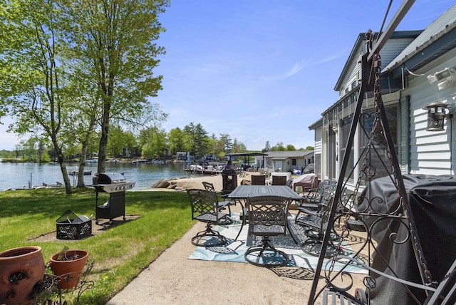 556 Weirs Blvd Unit 6, Laconia, NH 03246 - view of patio featuring grilling area, a water view, an outdoor fire pit, and outdoor dining space