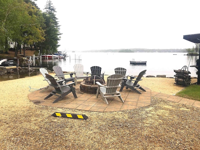 556 Weirs Blvd Unit 6, Laconia, NH 03246 - view of patio / terrace with a fire pit and a water view
