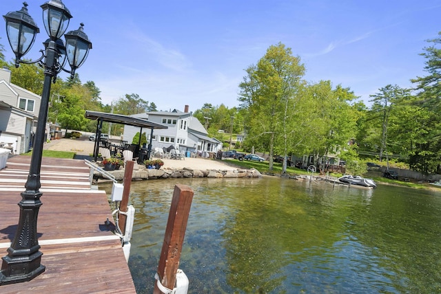 556 Weirs Blvd Unit 6, Laconia, NH 03246 - dock area with a water view and view of wooded area