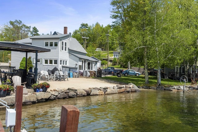 556 Weirs Blvd Unit 6, Laconia, NH 03246 - dock featuring a patio area and a water view