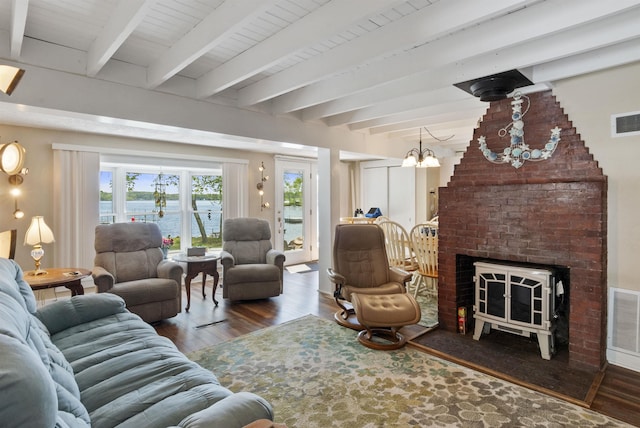 556 Weirs Blvd Unit 6, Laconia, NH 03246 - living room with wood finished floors, a water view, a chandelier, and beam ceiling
