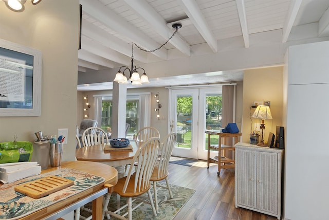 556 Weirs Blvd Unit 6, Laconia, NH 03246 - dining space with beam ceiling, wood finished floors, and a chandelier