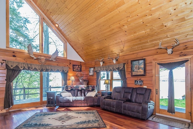 213 Singing Cedars Rd, Orwell, VT 05760 - living room with hardwood / wood-style flooring, wood walls, high vaulted ceiling, and wood ceiling