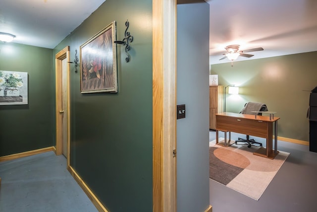 213 Singing Cedars Rd, Orwell, VT 05760 - hall with an office area, baseboards, and finished concrete flooring
