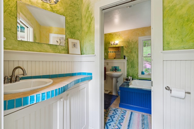44 Clarksville Rd, Tunbridge, VT 05077 - full bathroom featuring a sink and wainscoting