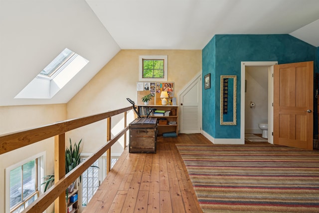 44 Clarksville Rd, Tunbridge, VT 05077 - hall featuring vaulted ceiling, a skylight, hardwood / wood-style floors, and baseboards