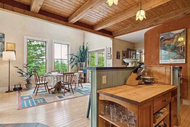 44 Clarksville Rd, Tunbridge, VT 05077 - kitchen with butcher block countertops, wood ceiling with exposed beams, light wood-type flooring, brown cabinets, and pendant lighting