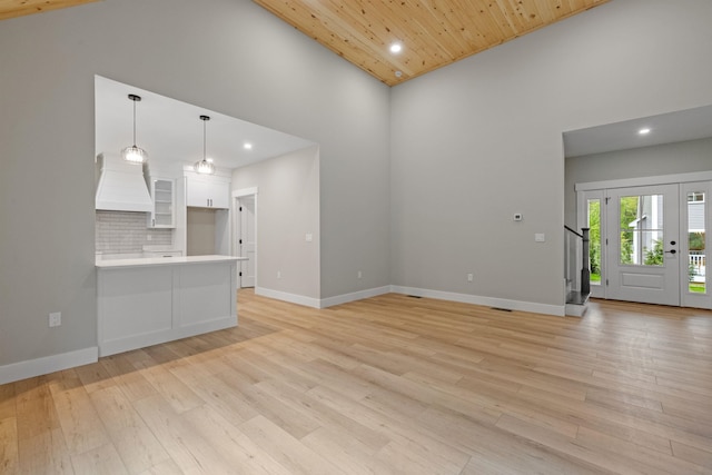 280 Sterling Dr, Laconia, NH 03246 - unfurnished living room with high vaulted ceiling, recessed lighting, light wood finished floors, wood ceiling, and baseboards