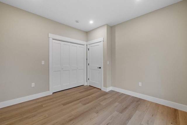 280 Sterling Dr, Laconia, NH 03246 - unfurnished bedroom with light wood-style flooring, baseboards, recessed lighting, and a closet