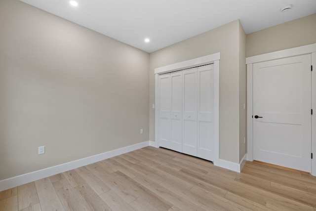 280 Sterling Dr, Laconia, NH 03246 - unfurnished bedroom featuring light wood-type flooring, baseboards, recessed lighting, and a closet