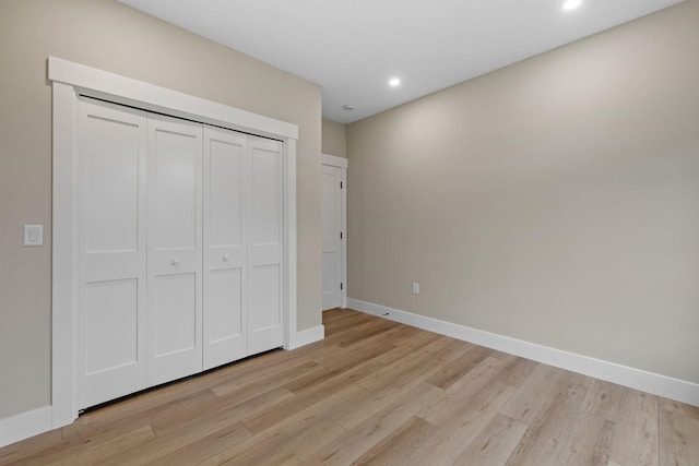 280 Sterling Dr, Laconia, NH 03246 - unfurnished bedroom featuring light wood finished floors, baseboards, recessed lighting, and a closet