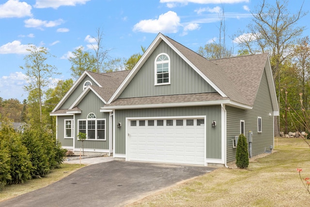 280 Sterling Dr, Laconia, NH 03246 - view of front of house featuring a shingled roof, a garage, driveway, and a front lawn