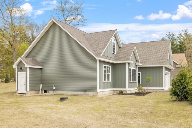 280 Sterling Dr, Laconia, NH 03246 - view of home's exterior featuring roof with shingles, a lawn, and an attached garage