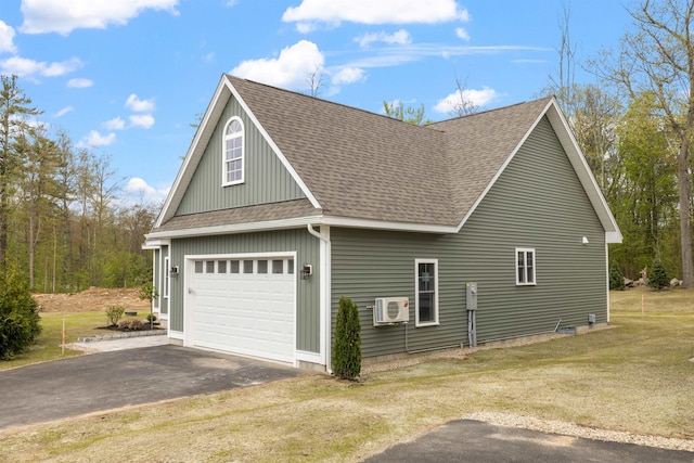 280 Sterling Dr, Laconia, NH 03246 - view of side of home featuring asphalt driveway, a shingled roof, a yard, ac unit, and an attached garage