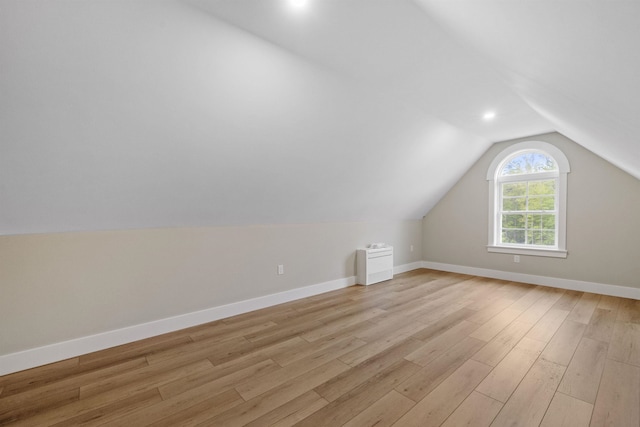 280 Sterling Dr, Laconia, NH 03246 - additional living space with light wood-type flooring, vaulted ceiling, and baseboards
