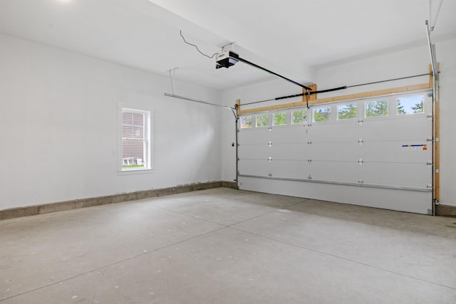 280 Sterling Dr, Laconia, NH 03246 - garage featuring a garage door opener and baseboards