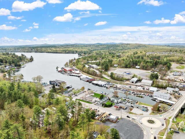 280 Sterling Dr, Laconia, NH 03246 - aerial view of property's location featuring a large body of water and a heavily wooded area