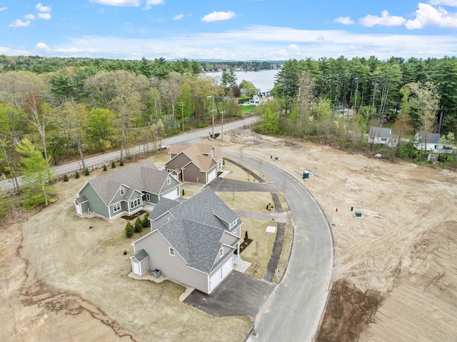 280 Sterling Dr, Laconia, NH 03246 - aerial view of property and surrounding area featuring a nearby body of water and a heavily wooded area