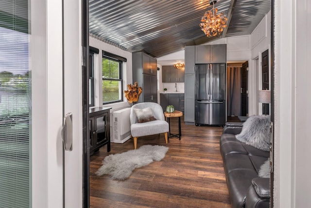 556 Weirs Blvd Unit 4, Laconia, NH 03246 - living room featuring a chandelier, lofted ceiling, and dark wood-style floors
