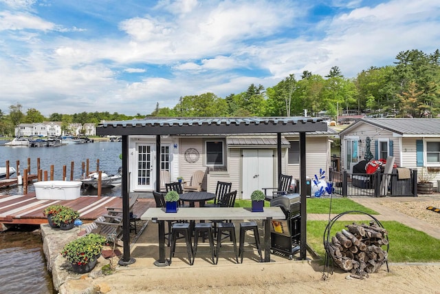 556 Weirs Blvd Unit 4, Laconia, NH 03246 - rear view of property featuring a water view, outdoor dining area, and a patio