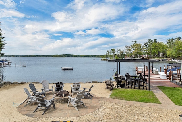 556 Weirs Blvd Unit 4, Laconia, NH 03246 - water view featuring a fire pit, a boat dock, and boat lift