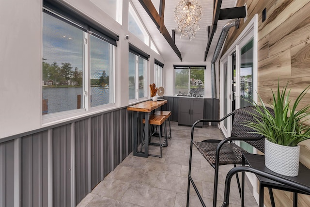 556 Weirs Blvd Unit 4, Laconia, NH 03246 - sunroom / solarium featuring a chandelier, tile patterned flooring, and a water view
