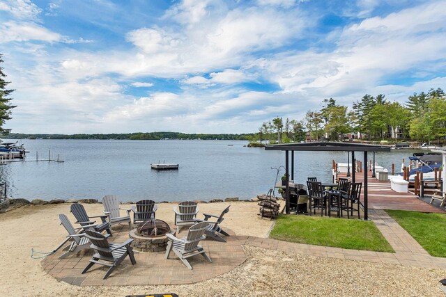 556 Weirs Blvd Unit 4, Laconia, NH 03246 - dock with an outdoor fire pit, a water view, and boat lift
