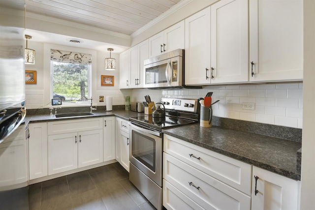 6049 Mountain Rd Unit 20, Stowe, VT 05672 - kitchen with stainless steel appliances, crown molding, a sink, white cabinets, and tasteful backsplash