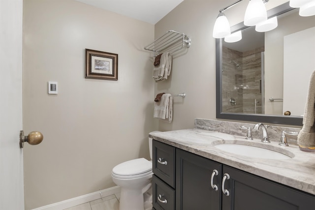 6049 Mountain Rd Unit 20, Stowe, VT 05672 - full bathroom with vanity, toilet, tiled shower, tile patterned flooring, and baseboards