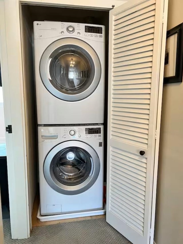 6049 Mountain Rd Unit 20, Stowe, VT 05672 - washroom with stacked washer / dryer