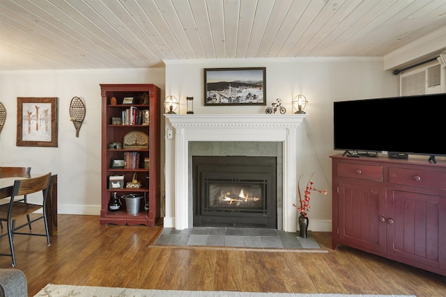 6049 Mountain Rd Unit 20, Stowe, VT 05672 - living area featuring crown molding, a fireplace with flush hearth, wooden ceiling, wood finished floors, and baseboards