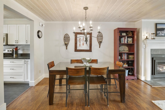 6049 Mountain Rd Unit 20, Stowe, VT 05672 - dining area featuring a chandelier, wood ceiling, a glass covered fireplace, crown molding, and dark wood-type flooring