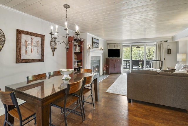 6049 Mountain Rd Unit 20, Stowe, VT 05672 - dining room featuring a lit fireplace, dark wood-style floors, wood ceiling, ornamental molding, and a chandelier