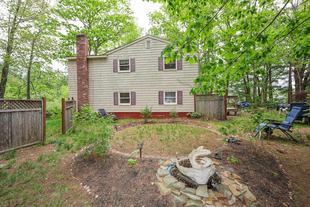 11 Riverside Dr, Rochester, NH 03867 - back of property featuring a chimney