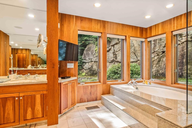 75 Westwood Rd, Sunapee, NH 03782 - full bath with plenty of natural light, vanity, a garden tub, recessed lighting, and wooden walls