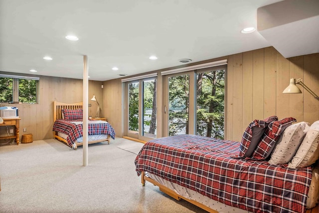 75 Westwood Rd, Sunapee, NH 03782 - carpeted bedroom with wood walls, access to exterior, and recessed lighting