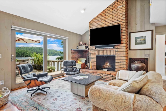 75 Westwood Rd, Sunapee, NH 03782 - living area featuring a fireplace, wooden walls, and high vaulted ceiling