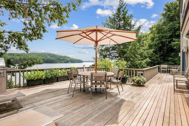 75 Westwood Rd, Sunapee, NH 03782 - wooden deck with outdoor dining area and a water view