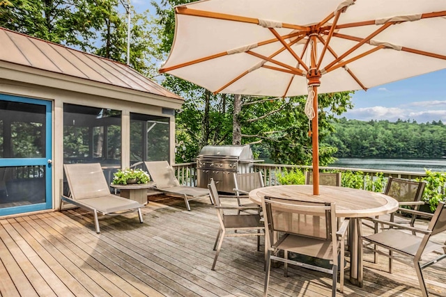 75 Westwood Rd, Sunapee, NH 03782 - wooden terrace with a sunroom, a grill, outdoor dining space, and a water view