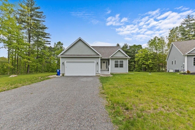 153 Ann Marie Ln, Colchester, VT 05446 - ranch-style home with driveway, an attached garage, a front yard, and central AC unit