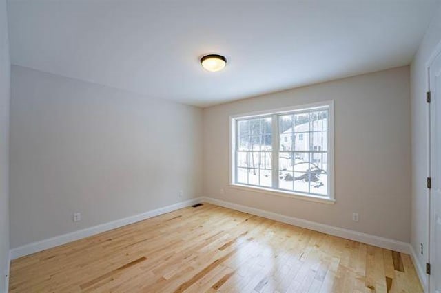 153 Ann Marie Ln, Colchester, VT 05446 - spare room with wood finished floors and baseboards