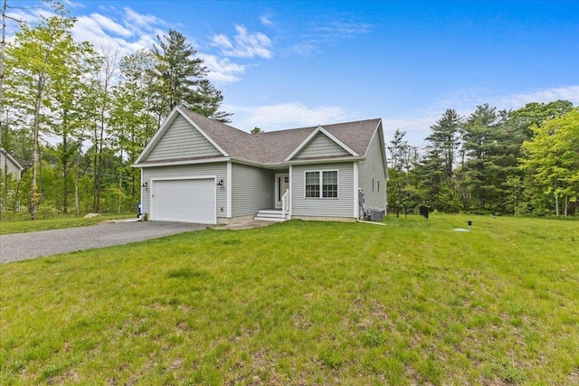 153 Ann Marie Ln, Colchester, VT 05446 - view of front of property with driveway, an attached garage, a front lawn, and central air condition unit