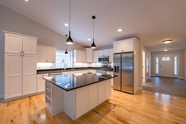 153 Ann Marie Ln, Colchester, VT 05446 - kitchen featuring stainless steel appliances, a sink, white cabinets, open shelves, and light wood finished floors