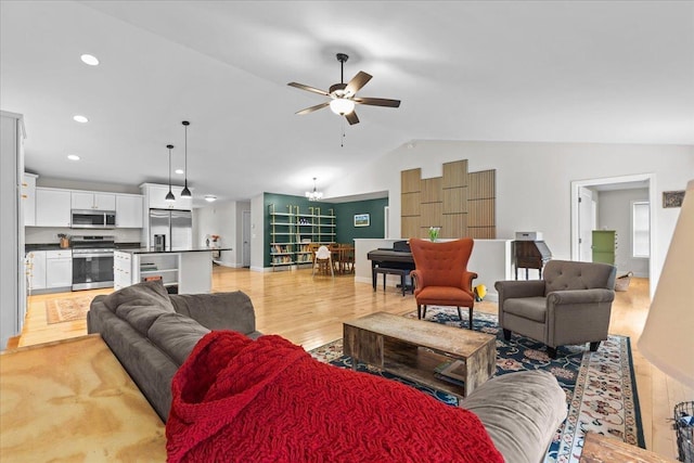 153 Ann Marie Ln, Colchester, VT 05446 - living room with lofted ceiling, light wood-style floors, ceiling fan, and recessed lighting