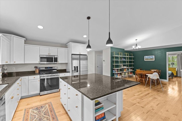 153 Ann Marie Ln, Colchester, VT 05446 - kitchen with appliances with stainless steel finishes, white cabinetry, a chandelier, open shelves, and light wood-style flooring