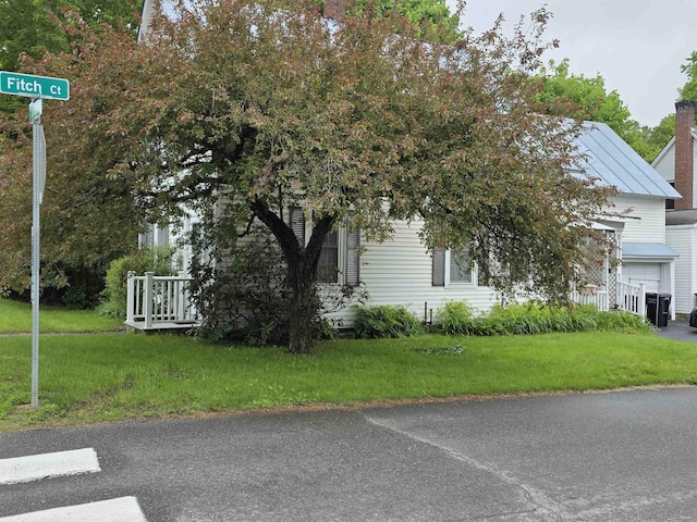 66 Union St, Windsor, VT 05089 - view of home's exterior featuring a lawn and a chimney