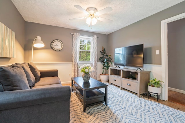 11 Beauchesne Dr, Hooksett, NH 03106 - living room with a textured ceiling, wood finished floors, ceiling fan, and baseboards