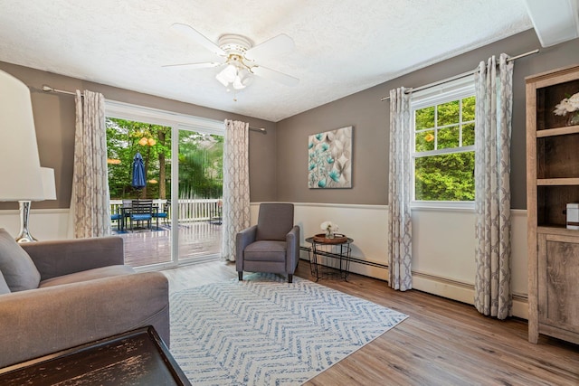 11 Beauchesne Dr, Hooksett, NH 03106 - sitting room featuring healthy amount of natural light, a ceiling fan, wood finished floors, and a textured ceiling