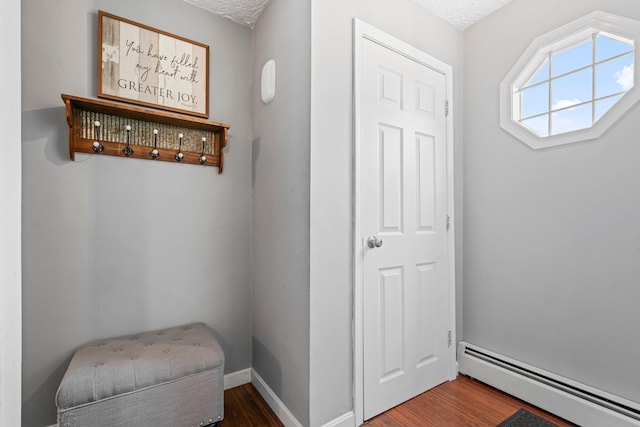11 Beauchesne Dr, Hooksett, NH 03106 - interior space featuring a baseboard radiator, wood finished floors, and baseboards