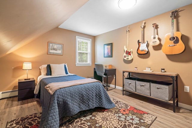 11 Beauchesne Dr, Hooksett, NH 03106 - bedroom featuring wood finished floors, vaulted ceiling, baseboard heating, and baseboards